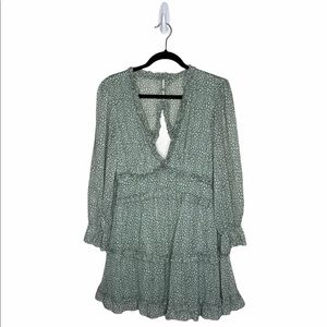 Green deep V neck, ruffle, mini dress. Boho vibes